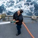 USS Kidd (DDG 100) Sailor Performs Freshwater Wash Down