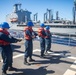 Sailors Handle Phone and Distance Line Aboard USS Antietam (CG 54)