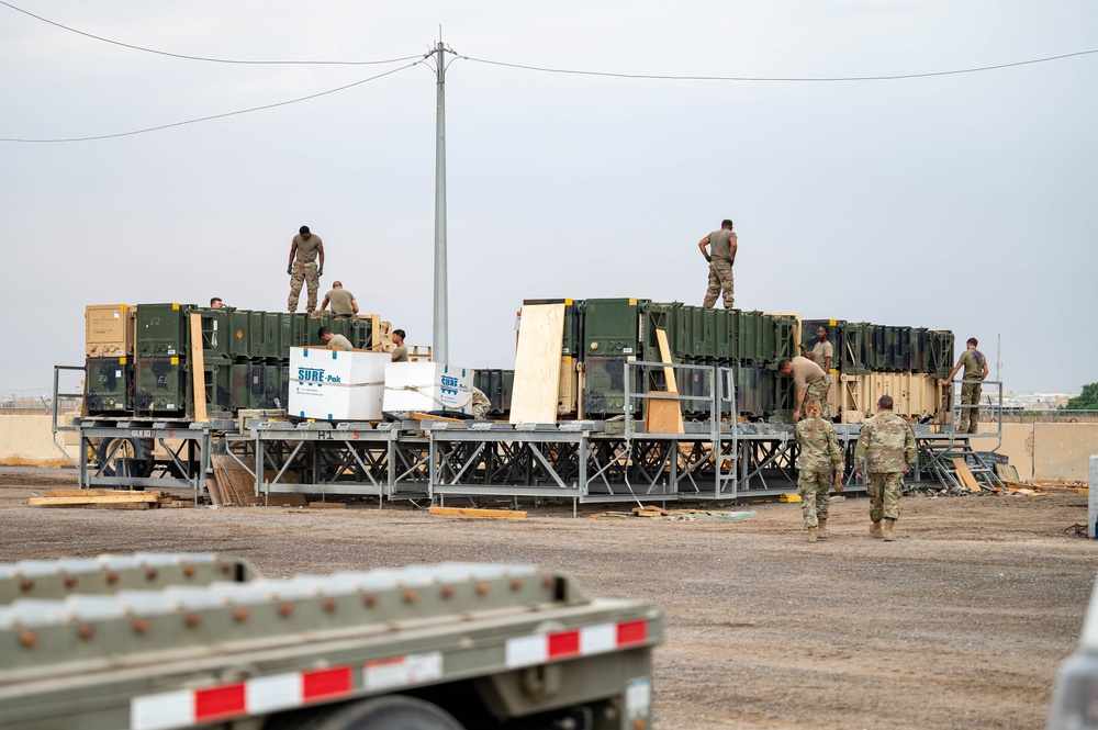 Soldiers and Airmen prepare Patriot Missiles for transportation