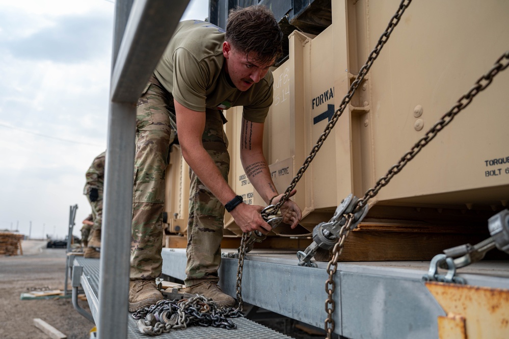 Soldiers and Airmen prepare Patriot Missiles for transportation