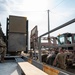 Soldiers and Airmen prepare Patriot Missiles for transportation