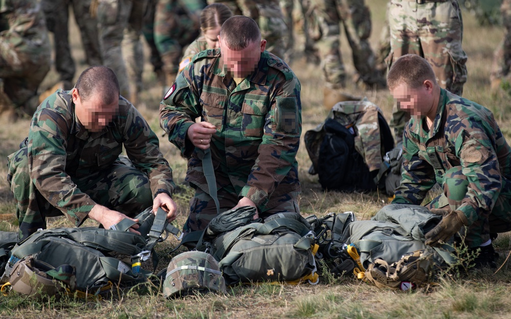 Paratroopers with Special Operations Command Europe jump with partners from Moldova