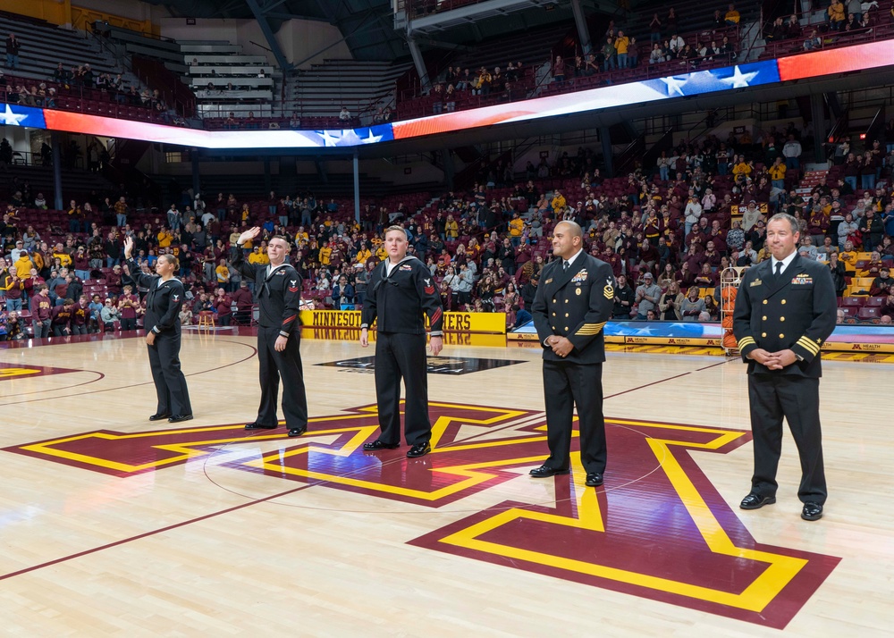 USS Minneapolis-Saint Paul (LCS 21) Sailors are recognozed during a University of Minnesota basketball game.