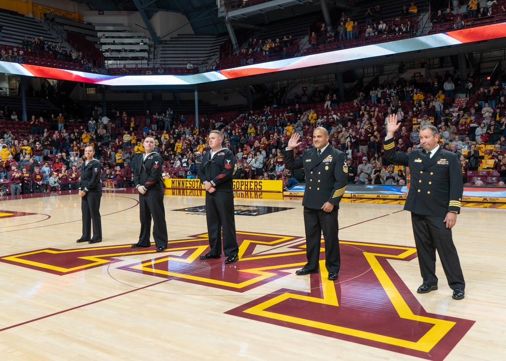 USS Minneapolis-Saint Paul (LCS 21) Sailors are recognozed during a University of Minnesota basketball game.