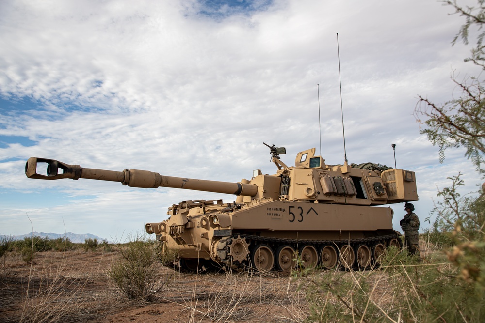 U.S. Army Soldier stands next to Paladin