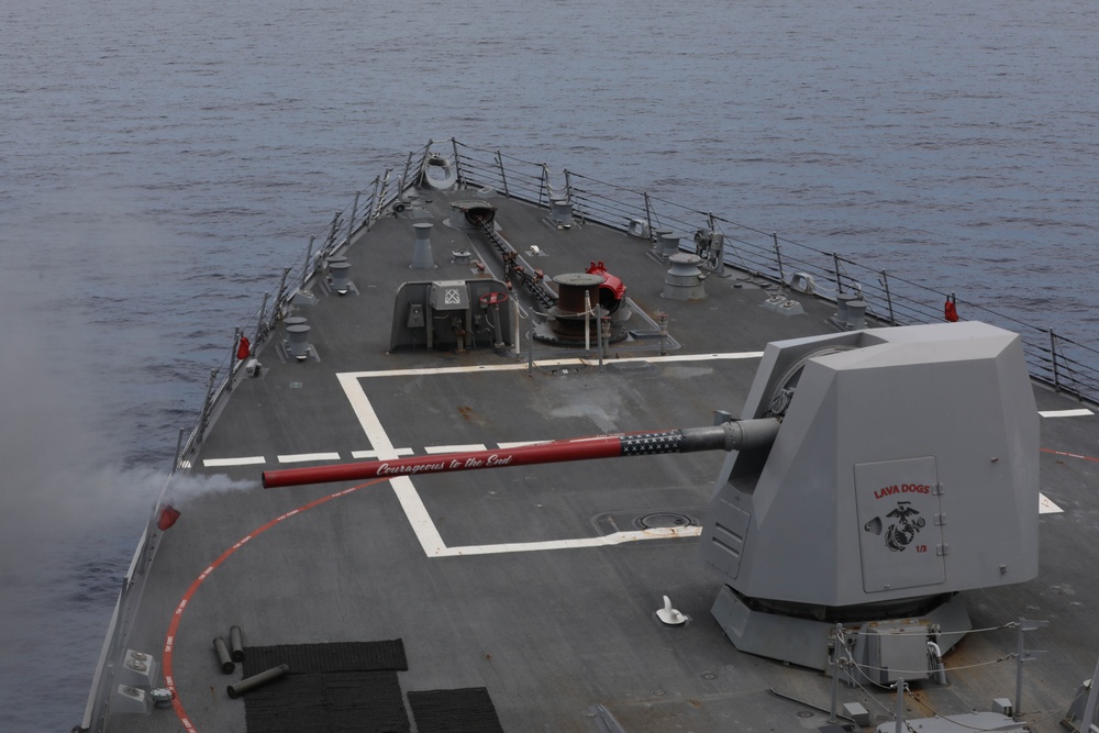 Sailors aboard the USS Rafael Peralta (DDG 115) conduct a live fire exercise with the HMCS Ottawa (FFH 341) and the HMAS Brisbane (DDG 41) as part of operation Noble Wolverine in the South China Sea