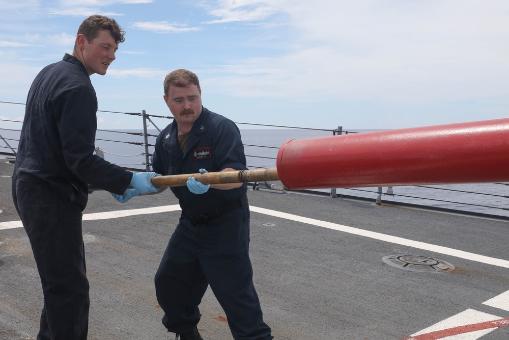 Sailors aboard the USS Rafael Peralta (DDG 115) conduct a live fire exercise with the HMCS Ottawa (FFH 341) and the HMAS Brisbane (DDG 41) as part of operation Noble Wolverine in the South China Sea