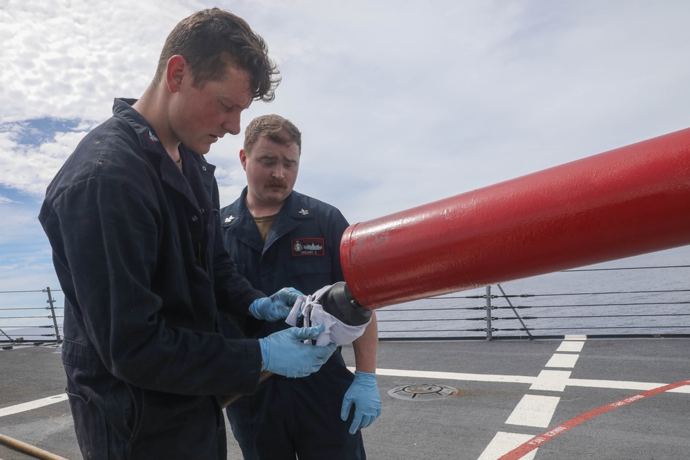 Sailors aboard the USS Rafael Peralta (DDG 115) conduct a live fire exercise with the HMCS Ottawa (FFH 341) and the HMAS Brisbane (DDG 41) as part of operation Noble Wolverine in the South China Sea