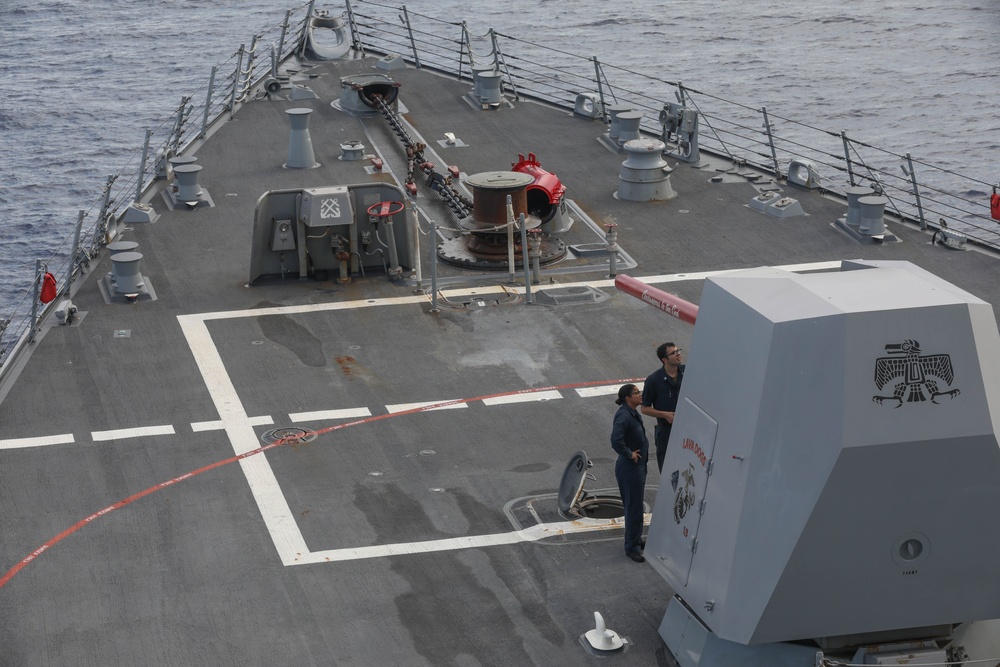 Sailors aboard the USS Rafael Peralta (DDG 115) conduct a live fire exercise with the HMCS Ottawa (FFH 341) and the HMAS Brisbane (DDG 41) as part of operation Noble Wolverine in the South China Sea