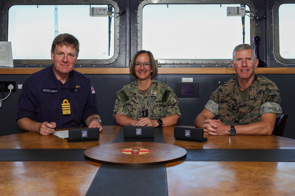 Gen. Smith, Adm. Franchetti, and First Sea Lord Key Sign a DCS Charter aboard the HMS Prince of Wales