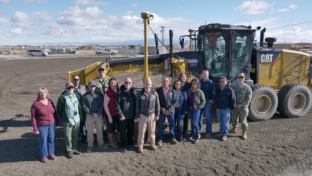NAS Fallon Commanding Officer stands with members of Puyenpa Construction, Duckwater Shoshone Tribe, NAVFAC PWD Fallon, and NAVSUP Fallon at the construction site.