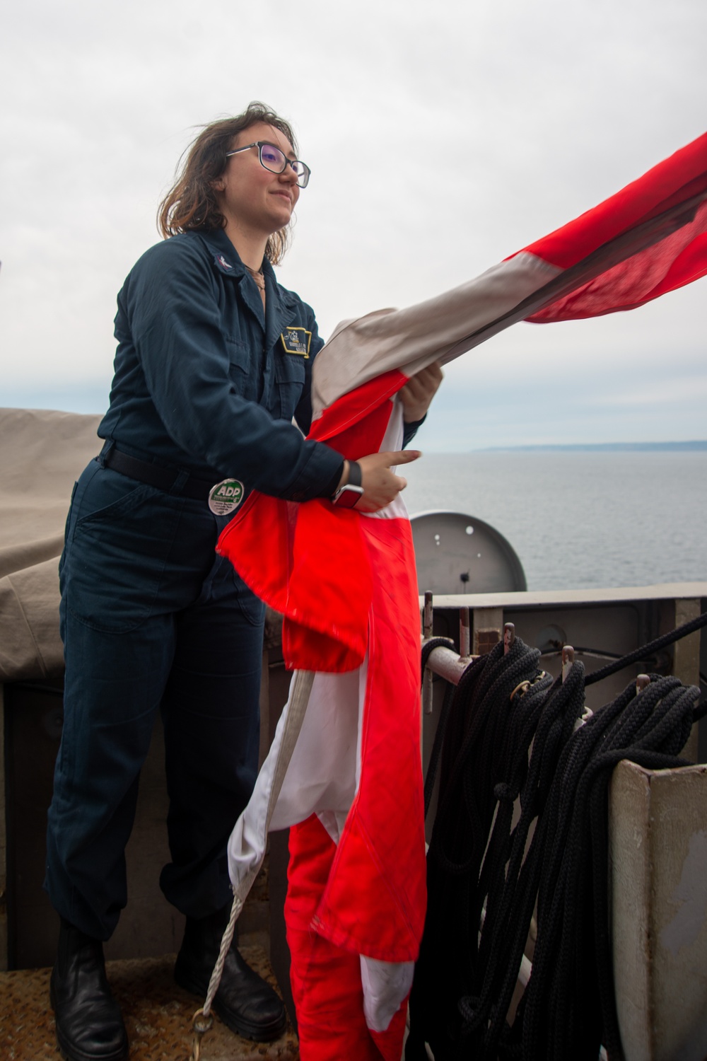 Sailor Raises Signal Flag
