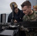 Marines familiarize themselves with machine guns aboard the USS New York
