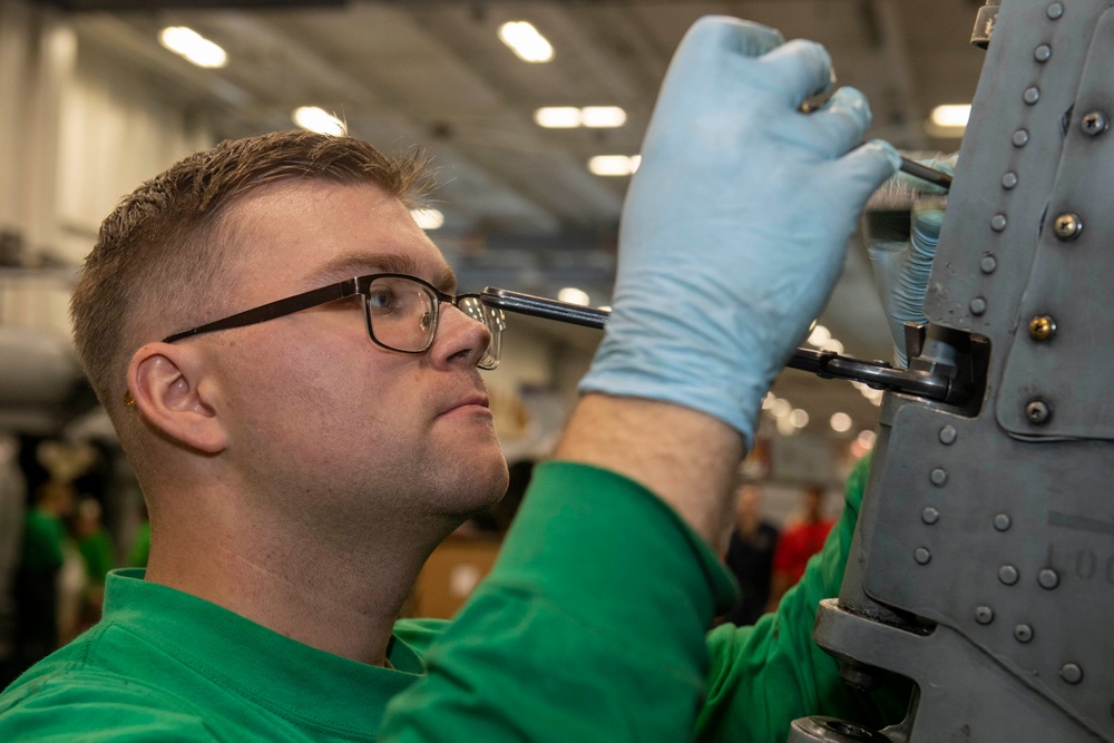 Sailors Assigned to Helicopter Maritime Strike Squadron (HSM) 78 Conduct Maintenance on an MH-60R Sea Hawk