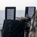 Marines and Sailors aboard the USS New York fire machine guns