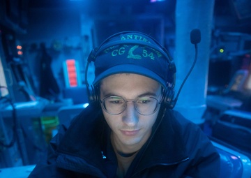 CTT1 Proctor Monitors Electronic Warfare Area Aboard USS Antietam (CG 54)