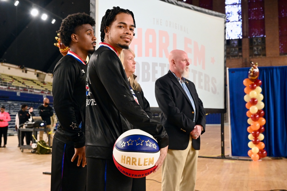 Operation Homefront brings Harlem Globetrotters, and holiday meal kits to D.C. Armory