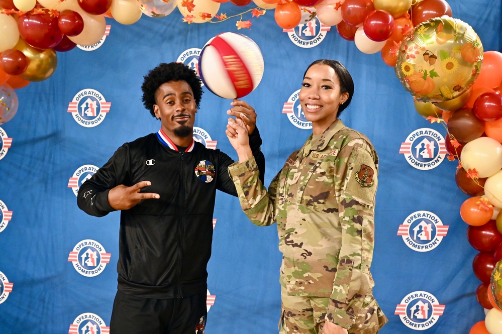 Operation Homefront brings Harlem Globetrotters, and holiday meal kits to D.C. Armory