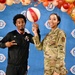 Operation Homefront brings Harlem Globetrotters, and holiday meal kits to D.C. Armory