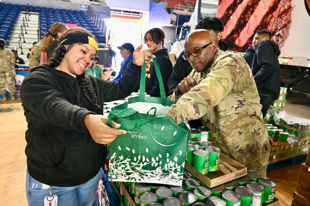 Operation Homefront brings Harlem Globetrotters, and holiday meal kits to D.C. Armory