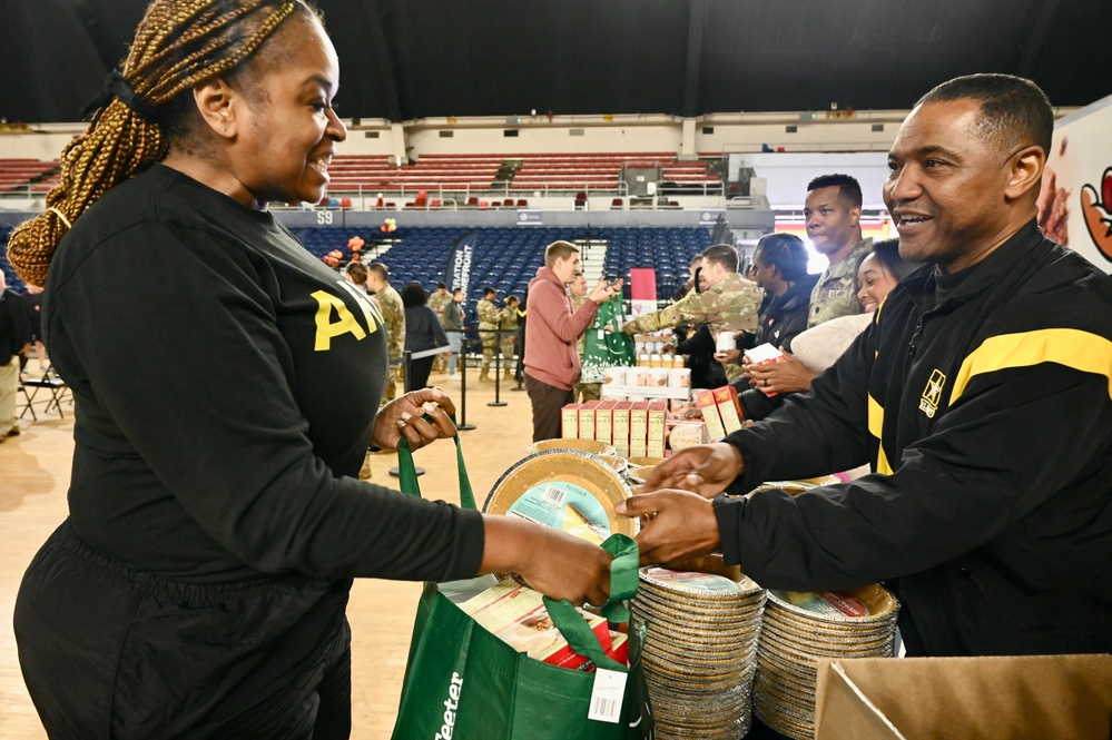 Operation Homefront brings Harlem Globetrotters, and holiday meal kits to D.C. Armory