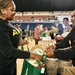 Operation Homefront brings Harlem Globetrotters, and holiday meal kits to D.C. Armory