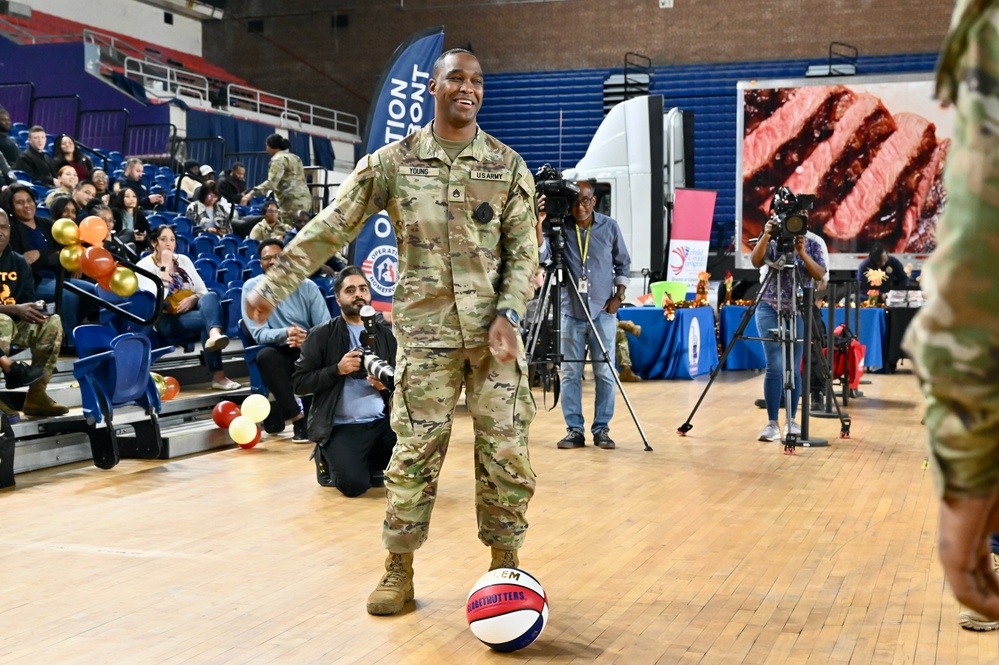 Operation Homefront brings Harlem Globetrotters, and holiday meal kits to D.C. Armory