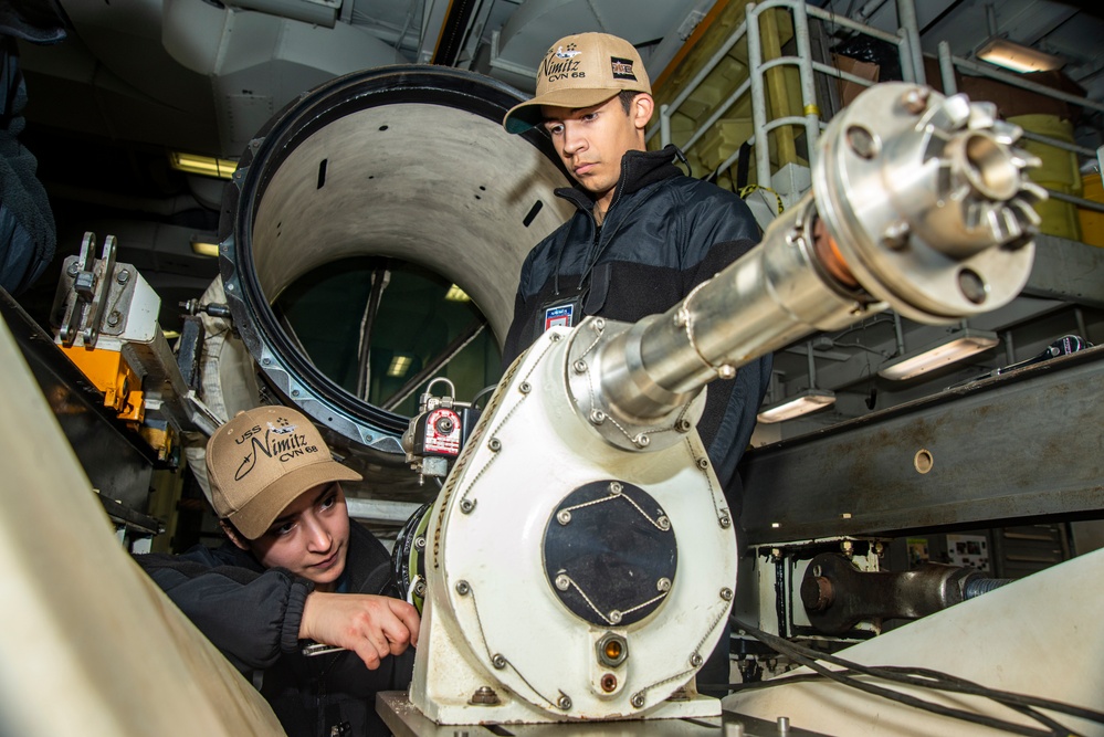 Sailors Work on Jet Engine