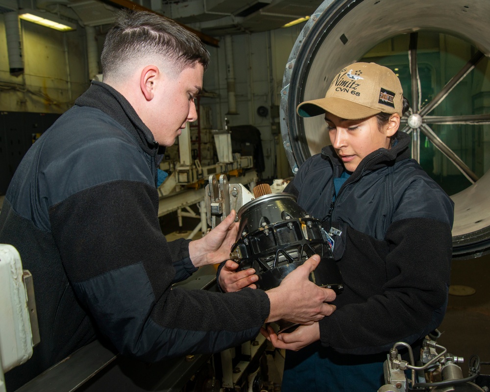 Sailors Work on Jet Engine