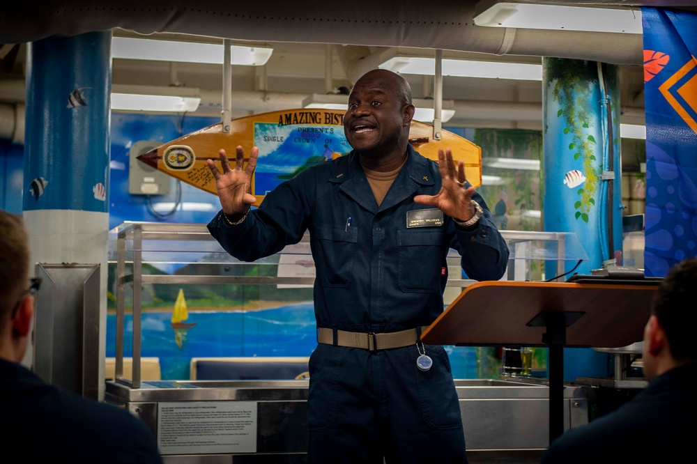 USS Hopper (DDG 70) Sailors hold Sunday Mass in the Pacific Ocean