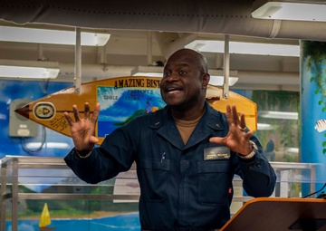 USS Hopper (DDG 70) Sailors hold Sunday Mass in the Pacific Ocean
