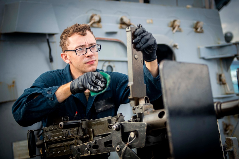 USS Hopper (DDG 70) Sailors Perform Maintenance on Machine Guns in the Pacific Ocean