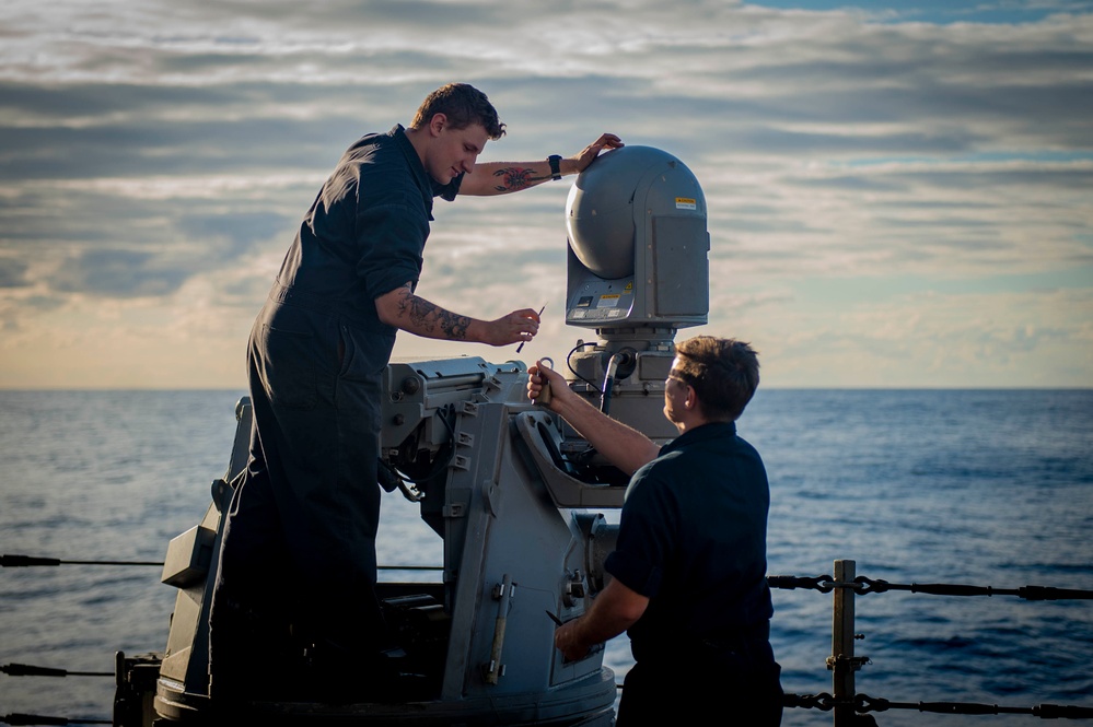 USS Hopper (DDG 70) Sailors Perform Maintenance on a shipboard weapons system in the Pacific Ocean