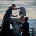USS Hopper (DDG 70) Sailors Perform Maintenance on a shipboard weapons system in the Pacific Ocean