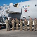 Photo of 116th Maintenance Group members receiving coins for outstanding work