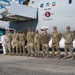 Photo of 116th Maintenance Group members receiving coins for outstanding work