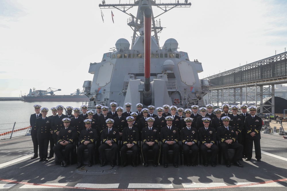 Officers aboard the USS Rafael Peralta (DDG 115) pose for a picture on the foc’sle during a scheduled port visit to Donghae, South Korea