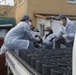 Sailors assigned to the USS Rafael Peralta (DDG 115) work with sailors assigned to the Republic of Korea Navy Daegu-class frigate ROKS Pohang (FFG-825) and the Korean government to provide coal to local houses in Donghae, Republic of Korea