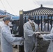 Sailors assigned to the USS Rafael Peralta (DDG 115) work with sailors assigned to the Republic of Korea Navy Daegu-class frigate ROKS Pohang (FFG-825) and the Korean government to provide coal to local houses in Donghae, Republic of Korea