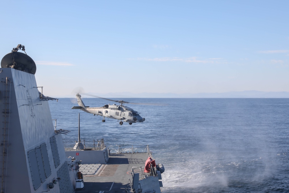 Sailors aboard the USS Rafael Peralta (DDG 115) launch a Sea Hawk helicopter (MH-60R) as part of Maritime Counter Special Operations Exercise (MCSOFEX)