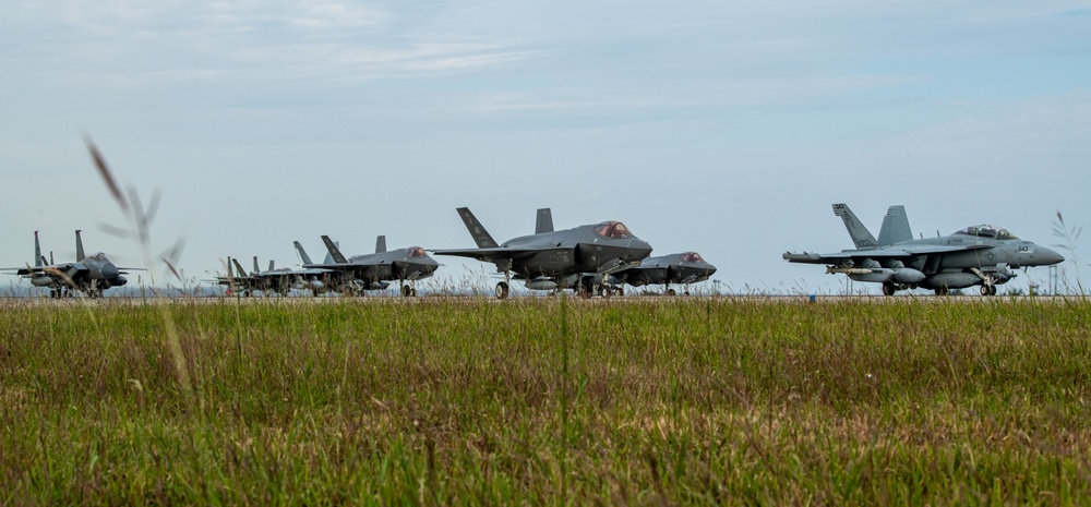 United in Strength: aircraft line the runway at Kadena Air Base