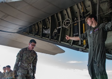 Reservist flight paramedics train active duty ground medical team on C-130H patient transfer