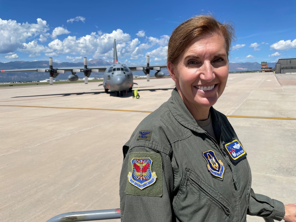 302nd Operations Group commander stands in front of C-130H