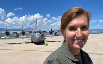 302nd Operations Group commander stands in front of C-130H