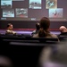 Retired Col. Harry Foster briefs Team McChord Airmen on AMC past, present, and future