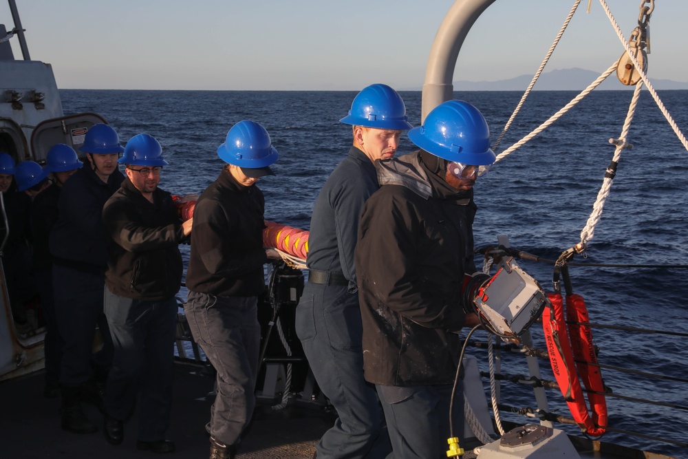 Sailors aboard the USS Rafael Peralta (DDG 115) conduct a sea and anchor detail in Yokosuka, Japan