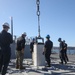 Sailors aboard the USS Rafael Peralta (DDG 115) conduct a missile offload in Yokosuka, Japan