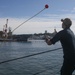 Sailors aboard the USS Rafael Peralta (DDG 115) conduct a sea and anchor detail in Yokosuka, Japan