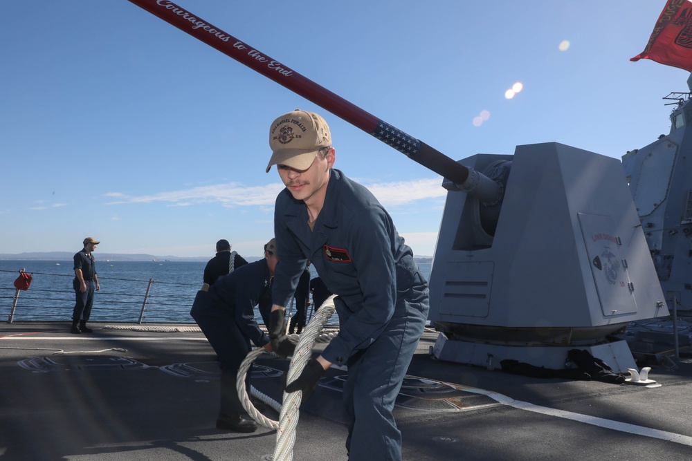 Sailors aboard the USS Rafael Peralta (DDG 115) conduct a sea and anchor detail in Yokosuka, Japan