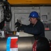 Sailors aboard the USS Rafael Peralta (DDG 115) conduct a torpedo handling event